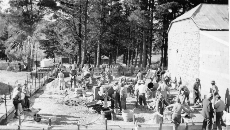 TA265  June 1957 Volunteers laying foundations for new hall
